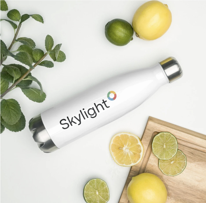 White water bottle with the Skylight logo