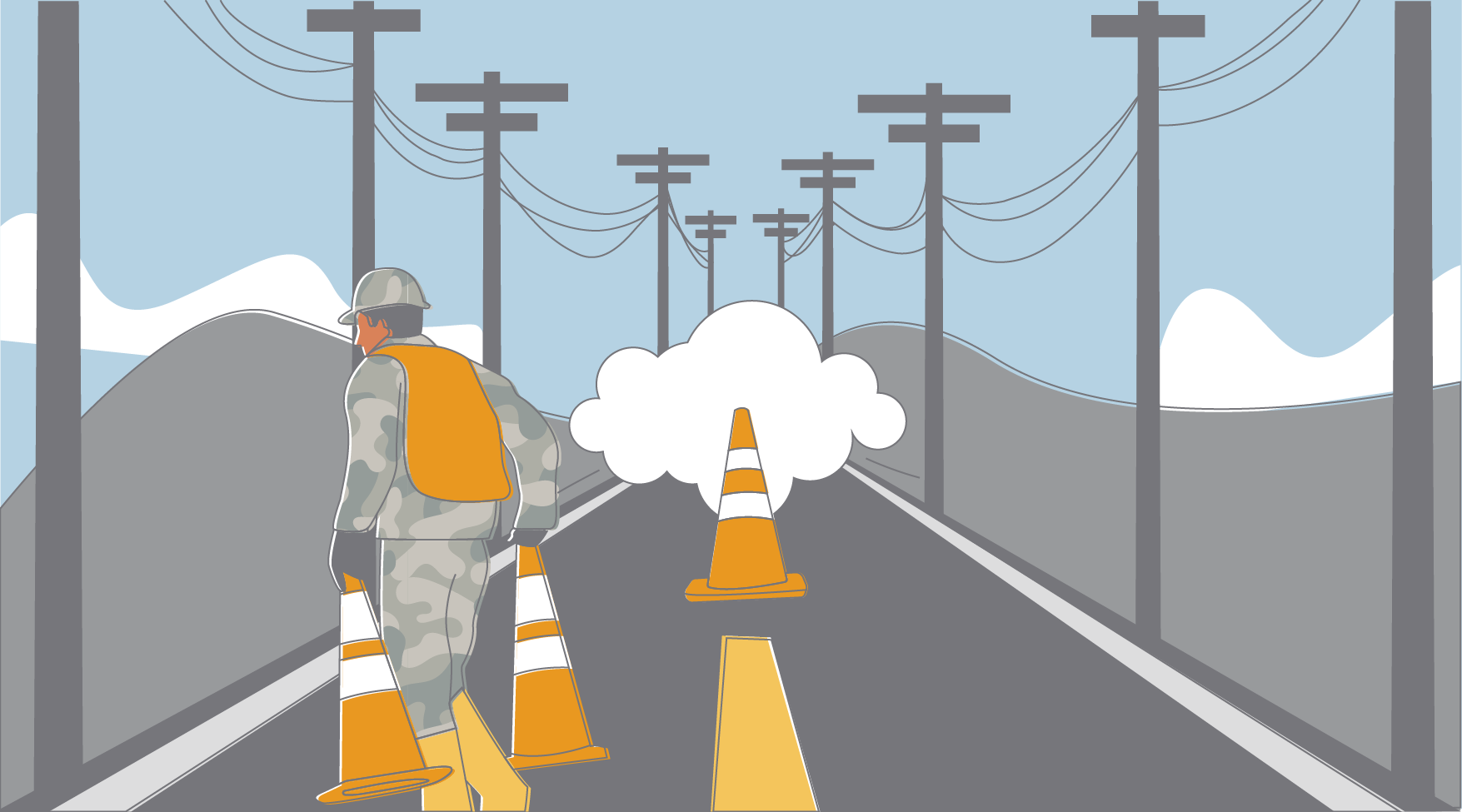 An airman removes traffic cones that were impeding the progress of a cloud.